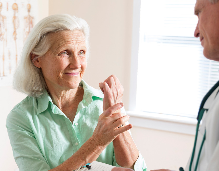 woman showing wrist pain for a doctor