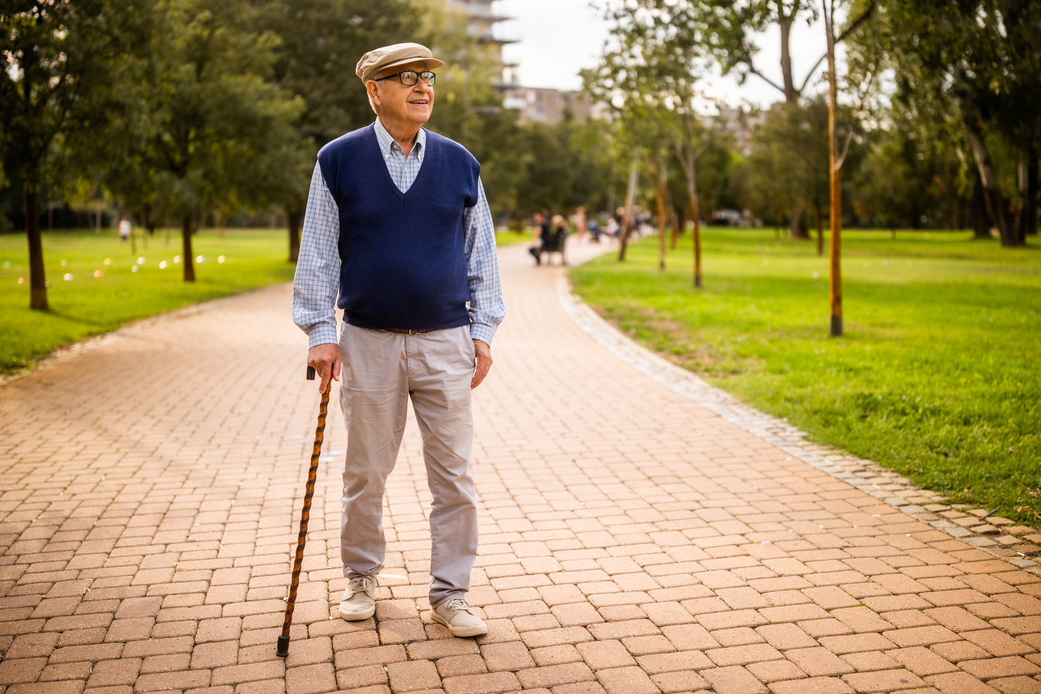 A person walking comfortably outdoors during fall joint replacement surgery recovery in South Carolina.